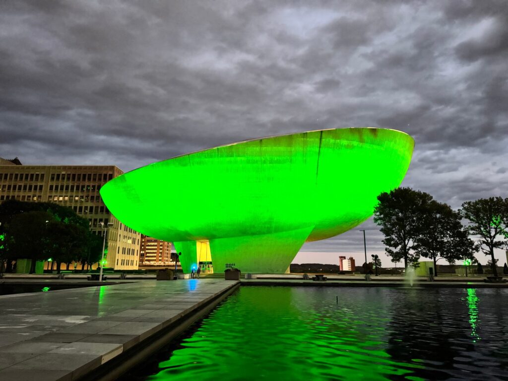 The Egg at Empire State Plaza in Albany glowing green over the reflecting pool, October 9, 2026